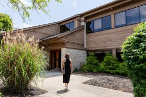 A woman approaches our Vein Center near Dublin, OH